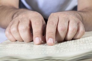 A person using Braille